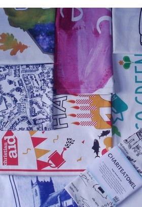 montage of screen printed fair trade organic tea towels including Christian Aid, Ecover, Glastonbury Festival, Ed Sheeran